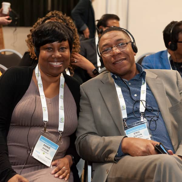 Photo of people listening to a podcast at the realtor quest.